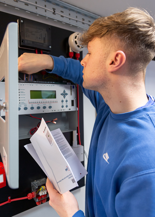 Young engineer working at Hochiki panel